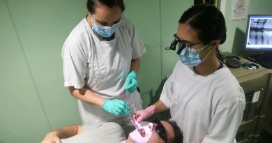 Leading Seaman Stacey Allen, left, and Lieutenant Danica Zhan provide dental care to Leading Seaman Damien Ripley while embarked in HMAS Stalwart. Story by Lieutenant Brendan Trembath. Photo by Chief Petty Officer Aaron Robinson.