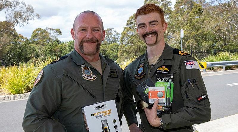 Chief Petty Officer Karl Beyer, left, the winner of best Movember moustache, along with the worst belonging to Acting Sub-Lieutenant Robbie Osborn. Photo by Petty Officer Justin Brown.
