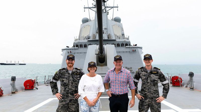 From left, Able Seaman Jordan Pagett, Ship Sponsor Nicola Hodgman, Australia's High Commissioner to Singapore Will Hodgman and Sub Lieutenant Bradley Cowen stand on the forecastle of HMAS Hobart in Singapore. Story by Lieutenant Brendan Trembath. Photo by Leading Seaman Daniel Goodman.