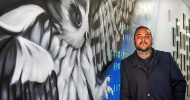 Artist and Ngarrindjeri man Thomas Readett stands beside his artwork at 462 Squadron Headquarters. Story by Flight Lieutenant Rob Hodgson. Photo by Leading Aircraftman Sam Price.