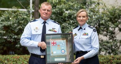 The outgoing Warrant Officer of the Air Force, WOFF-AF Fiona Grasby, hands over the mantle to her successor, WOFF-AF Ralph Clifton. Story by John Noble. Photo by Nicole Mankowski.