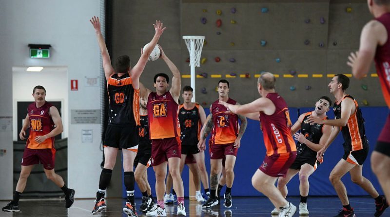 Able Seaman Michael Catley looks to pass the ball during the 2022 ADF Netball Championships. Story by Corporal Jacob Joseph. Photo by Sapper Alexis Friedewald.