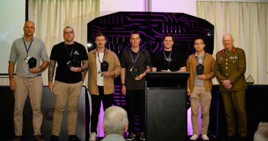 Chief of Joint Capabilities Lieutenant General John Frewen, right, with the winning ADF team in the capture-the-flag competition at the 2022 Cyber Skills Challenge. Photo by Corporal Olivia Cameron.