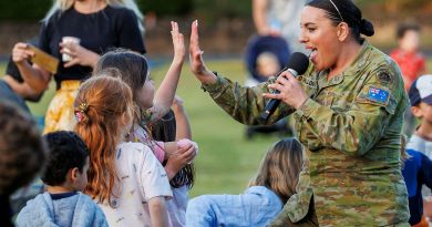 Australian Army musician Jade O'Halloran, from the Australian Army Band, performs at Carols at the Barracks. Story by Major Jesse Robilliard. Photo by Corporal Dustin Anderson.