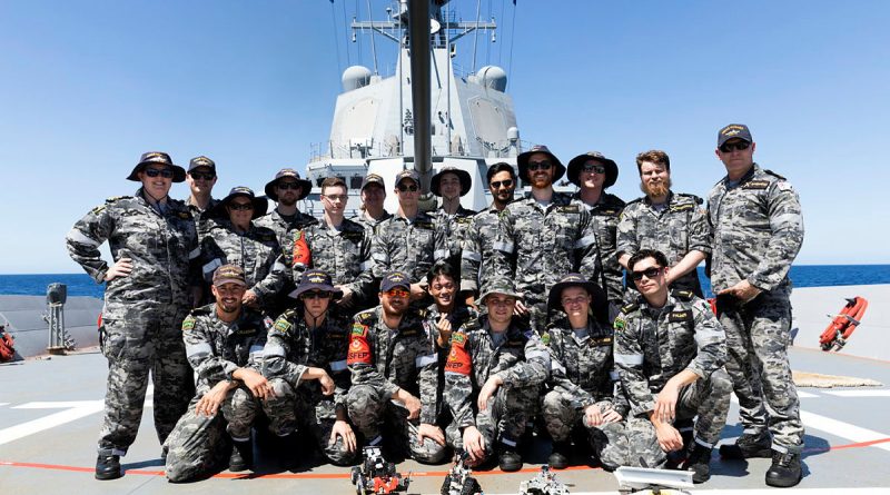 Electronic technicians on board HMAS Hobart on completion of the robot war competition. Story by Lieutenant Brendan Trembath. Photo by Leading Seaman Daniel Goodman.