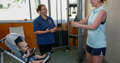 Leading Aircraftwoman Anna-Jayne Forrest, right, with daughter Millie, attends 1 Expeditionary Health Squadron's strength and conditioning session at RAAF Base Amberley. Story by Corporal Melina Young. Photo by Sergeant Peter Borys.