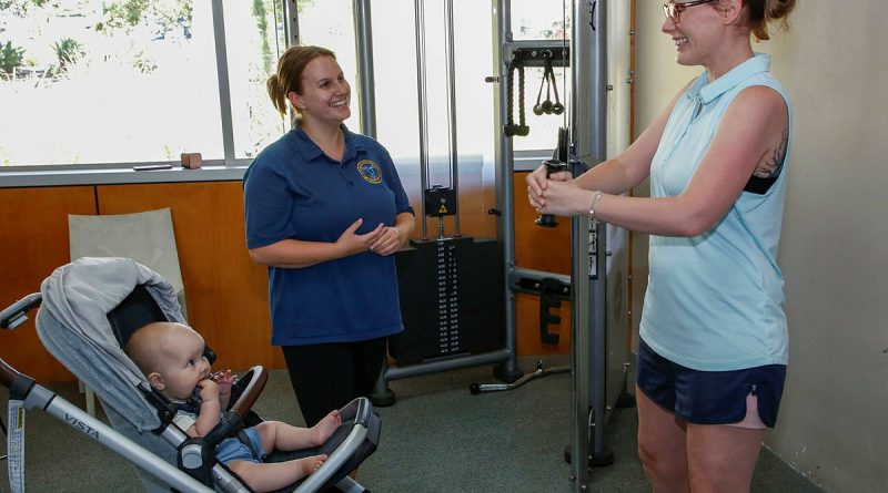 Leading Aircraftwoman Anna-Jayne Forrest, right, with daughter Millie, attends 1 Expeditionary Health Squadron's strength and conditioning session at RAAF Base Amberley. Story by Corporal Melina Young. Photo by Sergeant Peter Borys.