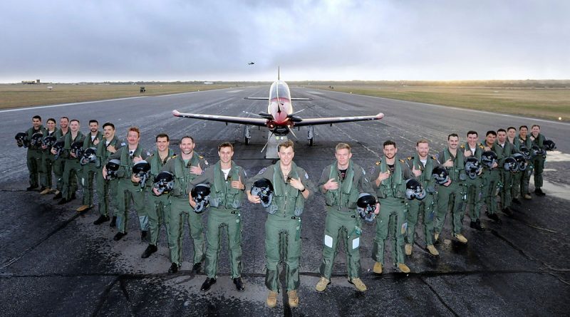 The 268 ADF Pilots Course members assemble at dawn on the flight line with a Pilatus PC-21 aircraft at RAAF Base Pearce in Western Australia. Story by Peta Magorian. Photo by Chris Kershaw.