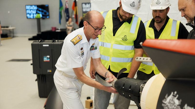 Director General Warfare Innovation, Royal Australian Navy, Commodore Darron Kavanagh inspects the ‘Dive-LD’ autonomous underwater vehicle. Photos by Dan Gosse Images.