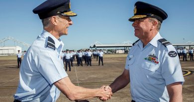 Outgoing Commander Air Combat Group Air Commodore Tim Alsop (left) congratulates the incoming Commanding Officer, Air Commodore Pete Robinson, on officially taking over command during the hand-over and take-over parade at RAAF Base Williamtown, NSW. Story by Flight Lieutenant Bronwyn Marchant. Photos by Corporal Craig Barrett.