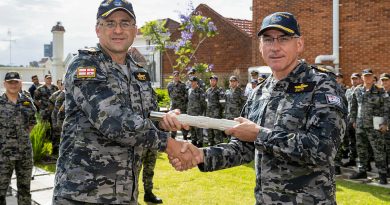 Rear Admiral Jonathan Earley hands over the 'weight of command' of His Majesty’s Australian Fleet to Rear Admiral Chris Smith during a ceremony at Fleet Headquarters, HMAS Kuttabul in Sydney. Story by Meg Van Lohuizen. Photo by Leading Seaman Matthew Lyall.