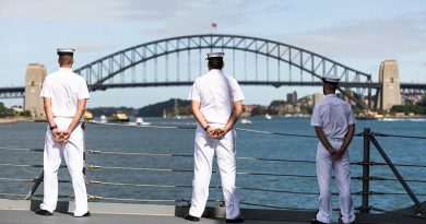 HMAS Hobart sailors line the deck as the ship sails into Sydney Harbour – home in time for Christmas.