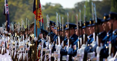 Australia's Federation Guard Present Arms during the Australia Day 2019 National Flag Raising and Citizenship Ceremony at Lake Burley Griffin in Canberra. Photo Petty Officer Paul Berry.