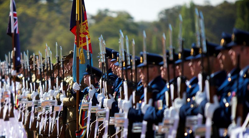 Australia's Federation Guard Present Arms during the Australia Day 2019 National Flag Raising and Citizenship Ceremony at Lake Burley Griffin in Canberra. Photo Petty Officer Paul Berry.