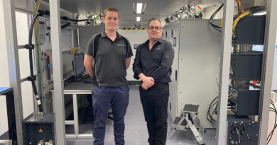 Leading Aircraftman Leigh Brettschneider (L) and his HENSOLDT Australia trainer Andrew Shegog at the operational maintenance trainer equipment room where trainees gain real-world experience on a working Airport Surveillance Radar - Next Generation. Story by Flight Lieutenant Julia Ravell.