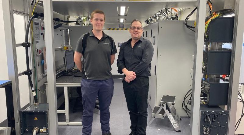 Leading Aircraftman Leigh Brettschneider (L) and his HENSOLDT Australia trainer Andrew Shegog at the operational maintenance trainer equipment room where trainees gain real-world experience on a working Airport Surveillance Radar - Next Generation. Story by Flight Lieutenant Julia Ravell.
