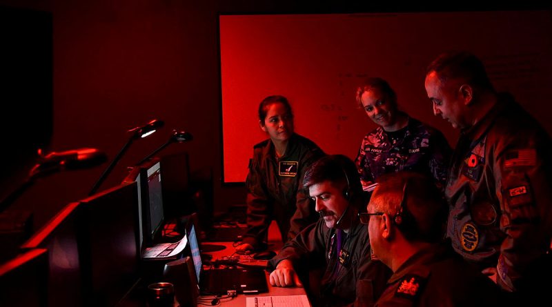 From left, RAAF Squadron Leader Katherine Wright, UN Navy Lieutenant Brady Martin, RAAF Corporal Hayley Davis, RAF Warrant Officer Graham Davis and US Navy Commander Pete Salvaggio take part in Exercise Resolute Hunter in Nevada, US. Story by Lieutenant Commander John Thompson. Photo by Lindsey Lauer.