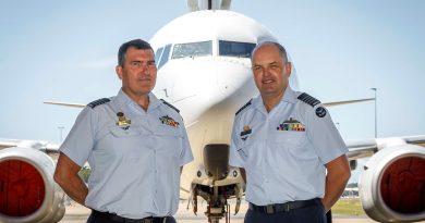 Incoming Officer Commanding 42 Wing Group Captain James Parton (left) and outgoing Commander Group Captain Angus Porter in front of a 2 Squadron E-7A Wedgetail at RAAF Base Williamtown, NSW. Story by Leading Aircraftwoman Jasna McFeeters. Photo by Corporal Craig Barrett.