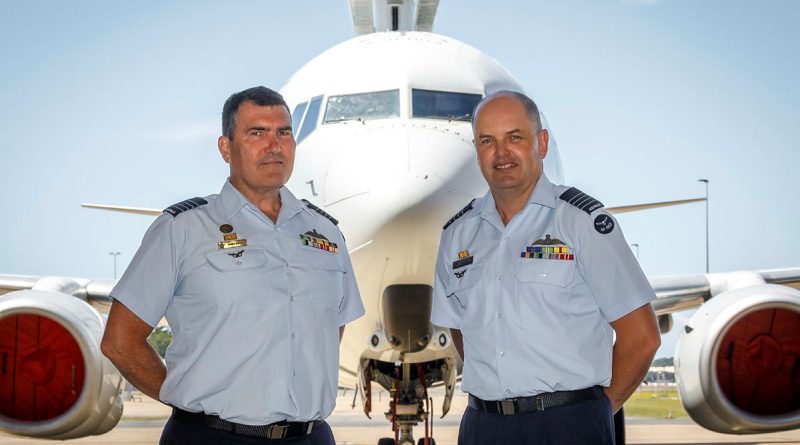 Incoming Officer Commanding 42 Wing Group Captain James Parton (left) and outgoing Commander Group Captain Angus Porter in front of a 2 Squadron E-7A Wedgetail at RAAF Base Williamtown, NSW. Story by Leading Aircraftwoman Jasna McFeeters. Photo by Corporal Craig Barrett.