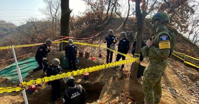 Australian observer Leading Aircraftman Ben Whitfield, right, observes personnel from the Ministry of National Defense for Killed in Action Recovery and Identification conduct human remains recovery at White Horse Hill. Story and photo by Petty Officer Jason Wilson.