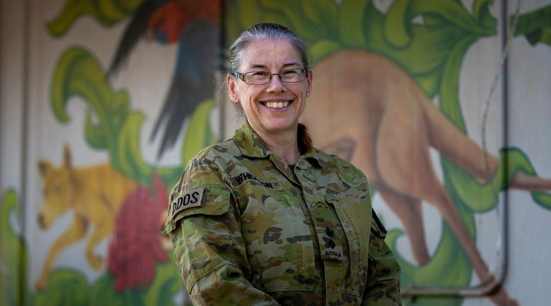 Australian Army Lieutenant Colonel Wendy Wheadon, Combined Joint Task Force - Operation Inherent Resolve Deputy Director of Sustainment, stands before the mural at Aussie House inside US military base Camp Arifjan, Kuwait. Story and photo by Corporal Jacob Joseph.