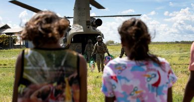 Members of C Squadron, 5th Aviation Regiment, unload groceries off an Army CH-47 Chinook helicopter for the Yungngora people returning to their homes in Noonkanbah. Story by Flight Lieutenant Dean Squire. Photo by Leading Aircraftwoman Kate Czerny.