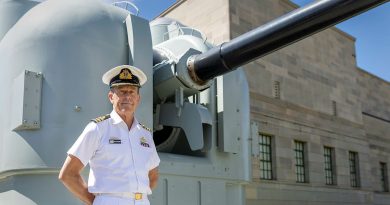 Curator and AWM Navy Fellow Commander Andrew Schroder stands in front of one of HMAS Brisbane’s 5-inch gun mounts as depicted in the online exhibition. Story and photo by Corporal Jacob Joseph.