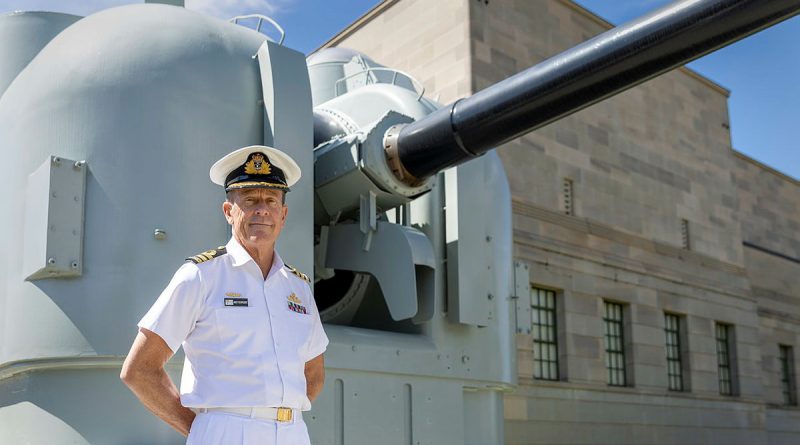 Curator and AWM Navy Fellow Commander Andrew Schroder stands in front of one of HMAS Brisbane’s 5-inch gun mounts as depicted in the online exhibition. Story and photo by Corporal Jacob Joseph.