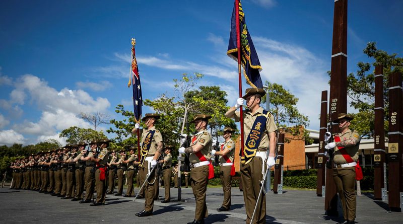 Soldiers from 3rd Battalion, The Royal Australian Regiment, on parade during the Australia Day flag raising ceremony at Jezzine Barracks, Townsville. Story by Major Taylor Lynch. Photo by Bombardier Guy Sadler.