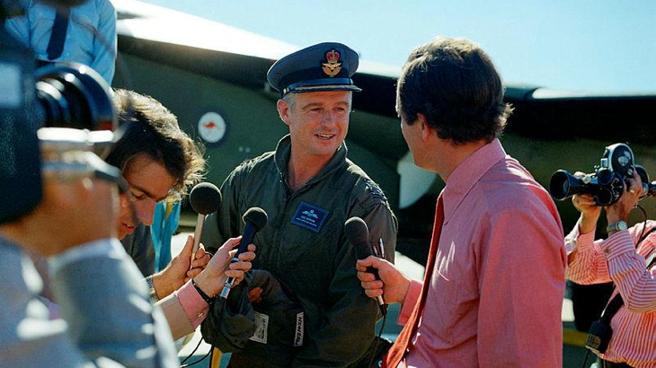 Then Group Captain Jake Newham in 1973 talks to the waiting media after leading the ferry flight of six A8 F111s from Fort Worth, Texas, to Amberley, Australia. Story by RAAF Historian Martin James.