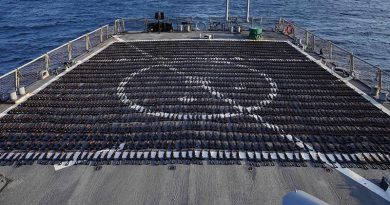 Thousands of AK-47 assault rifles sit on the flight deck of guided-missile destroyer USS The Sullivans during a post-seizure inventory process. US Navy photo.