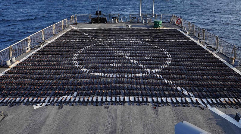 Thousands of AK-47 assault rifles sit on the flight deck of guided-missile destroyer USS The Sullivans during a post-seizure inventory process. US Navy photo.