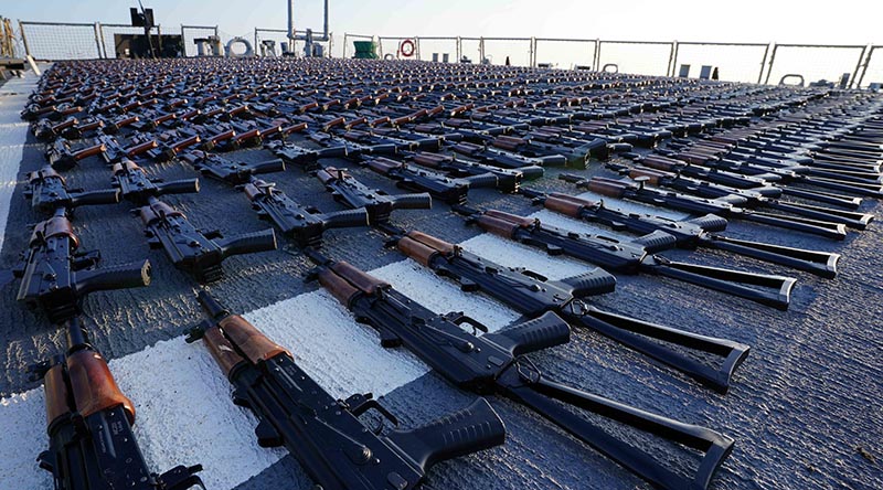 Thousands of AK-47 assault rifles sit on the flight deck of guided-missile destroyer USS The Sullivans during a post-seizure inventory process. US Navy photo.