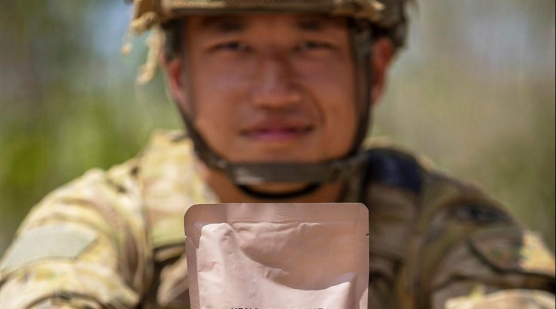 Private Johnny Huang, from 7RAR, holds a combat ration pack main meal at Mount Bundey training area. Story and photo by Corporal Jacob Joseph.