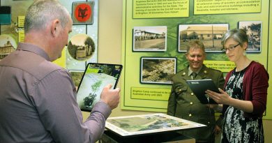 Ben and Kate Hibbert, assisted by Warrant Officer Class 2 Craig Jeffery, view the ‘Windows to the Past’ Anglesea Barracks Augmented Reality application. Story by Private Nicholas Marquis. Photo by Sergeant William Guthrie.