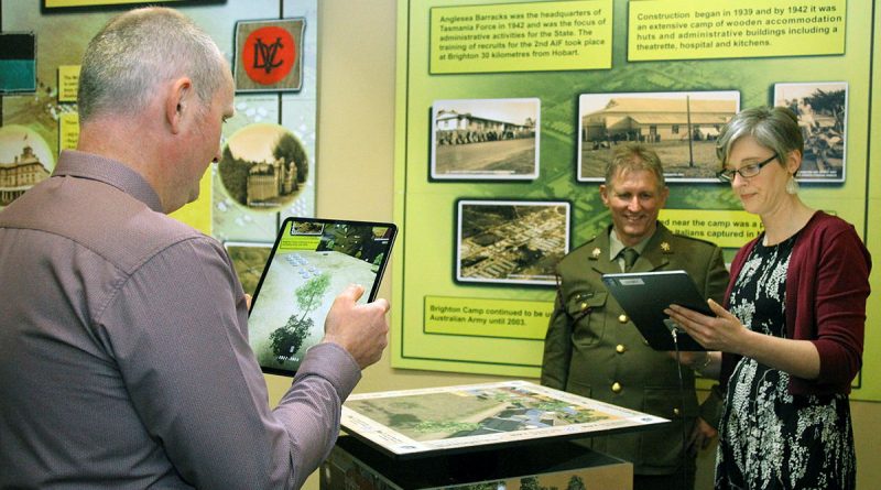 Ben and Kate Hibbert, assisted by Warrant Officer Class 2 Craig Jeffery, view the ‘Windows to the Past’ Anglesea Barracks Augmented Reality application. Story by Private Nicholas Marquis. Photo by Sergeant William Guthrie.