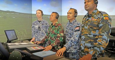 Flight Lieutenant Rhiannon Wares (RAAF), First Lieutenant Hery (Indonesia Air Force), Major Hafizul (Royal Malaysian Air Force) and Squadron Leader Chamara (Sri Lanka Air Force) in the School of Air Traffic Control’s immersive tower visual simulator system at RAAF Base East Sale. Story by Flying Officer Rowan Crinall. Photo by Petty Officer Richard Prideaux.
