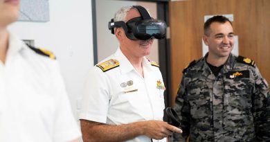 Commander Australian Fleet Rear Admiral Chris Smith tests a Defence Force Recruiting virtual reality headset at Russell Offices in Canberra. Story by Petty Officer Jake Badior. Photo by Leading Seaman Tara Morrison.