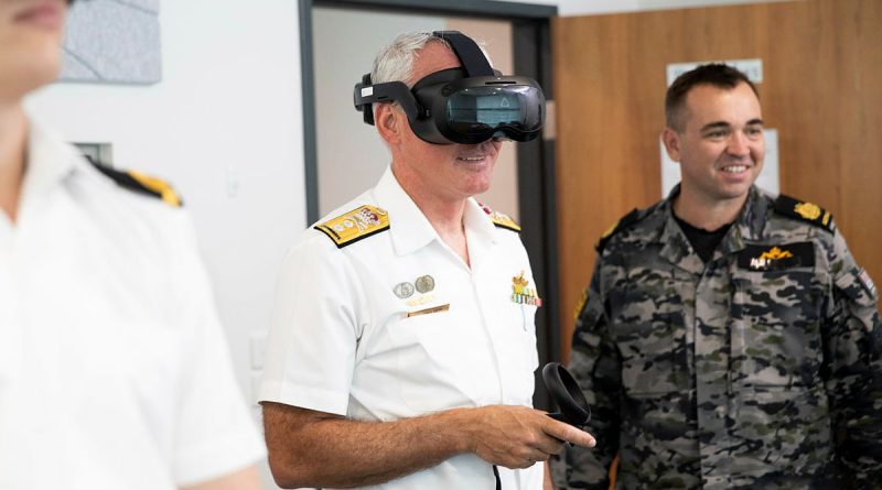 Commander Australian Fleet Rear Admiral Chris Smith tests a Defence Force Recruiting virtual reality headset at Russell Offices in Canberra. Story by Petty Officer Jake Badior. Photo by Leading Seaman Tara Morrison.