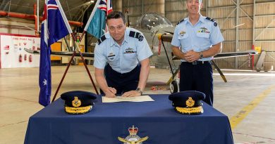 Incoming Commander Air Warfare Centre Air Commodore Adrian Maso, signs the transfer of command certificate witnessed by the outgoing Commander Air Commodore Ross Bender. Story by Flight Lieutenant Rob Hodgson. Photo by Corporal David Cotton.