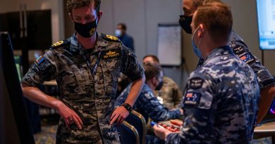 Lieutenant Commander Benjamin Piggott from Defence Space Command talking with other ADF team members on Exercise Global Sentinel 22 in California. Story by Corporal Michael Rogers.