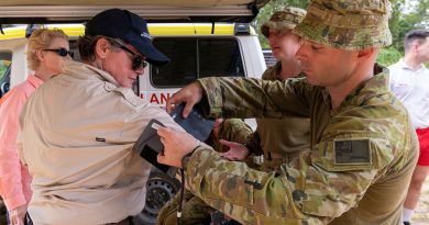 Australian Army soldier Private Thomas Marshall, right, from the 3rd Health Battalion, fits a blood pressure cuff to Megan Stifler, Deputy Commissioner Strategic Capability, Fire and Rescue NSW. Photo by Corporal Michael Currie.