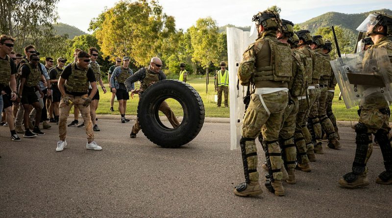 Army soldiers defend against role players as part of a readiness protection course. Story by Captain Joanne Leca. Photo by Bombardier Guy Sadler.