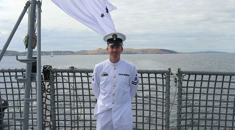 Petty Officer Adam O'Brien stands on the flight deck as HMAS Arunta pulls into Hobart ahead of the 185th Royal Hobart Regatta. Story and photo by Sub-Lieutenant Tahlia Merigan.