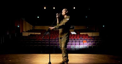 Squadron Leader Aleisha Croxford on stage at the Gungahlin College Theatre in Canberra. Story and photo by Private Nicholas Marquis.