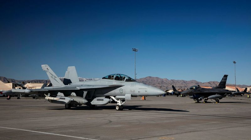 A Royal Australian Air Force EA-18G Growler taxis past a United States Air Force F-16 Falcon at Nellis Air Force Base, Nevada, during Exercise Red Flag 23-1. Story by Flying Officer Connor Bellhouse. Photo by Air Specialist (Class 1) Samantha Holden, Royal Air Force.