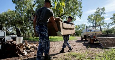 Members of Air Force’s 77 Squadron work to remove flood damaged items from affected properties in Fitzroy Crossing. Story by Flight Lieutenant Grace Casey-Maughan. Photo by Leading Aircraftwoman Kate Czerny.