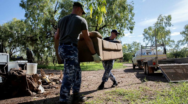 Members of Air Force’s 77 Squadron work to remove flood damaged items from affected properties in Fitzroy Crossing. Story by Flight Lieutenant Grace Casey-Maughan. Photo by Leading Aircraftwoman Kate Czerny.