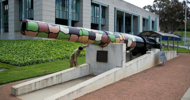 An Australian soldier inspects the barrel of the Amiens Gun located at the Australian War Memorial, Canberra. Story and photo by Private Nicholas Marquis.