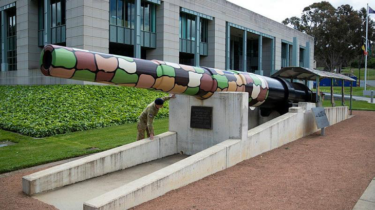 An Australian soldier inspects the barrel of the Amiens Gun located at the Australian War Memorial, Canberra. Story and photo by Private Nicholas Marquis.